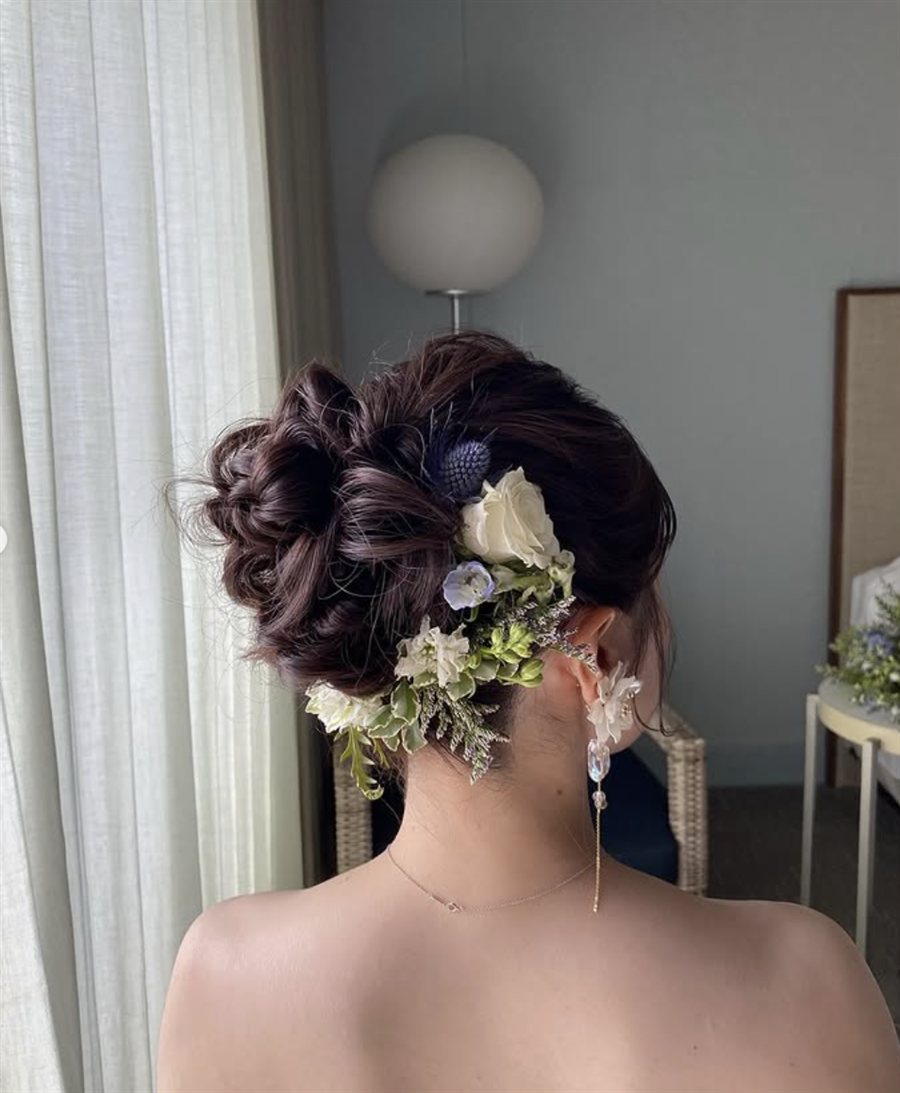 Loose bridal updo with white rose and thistle