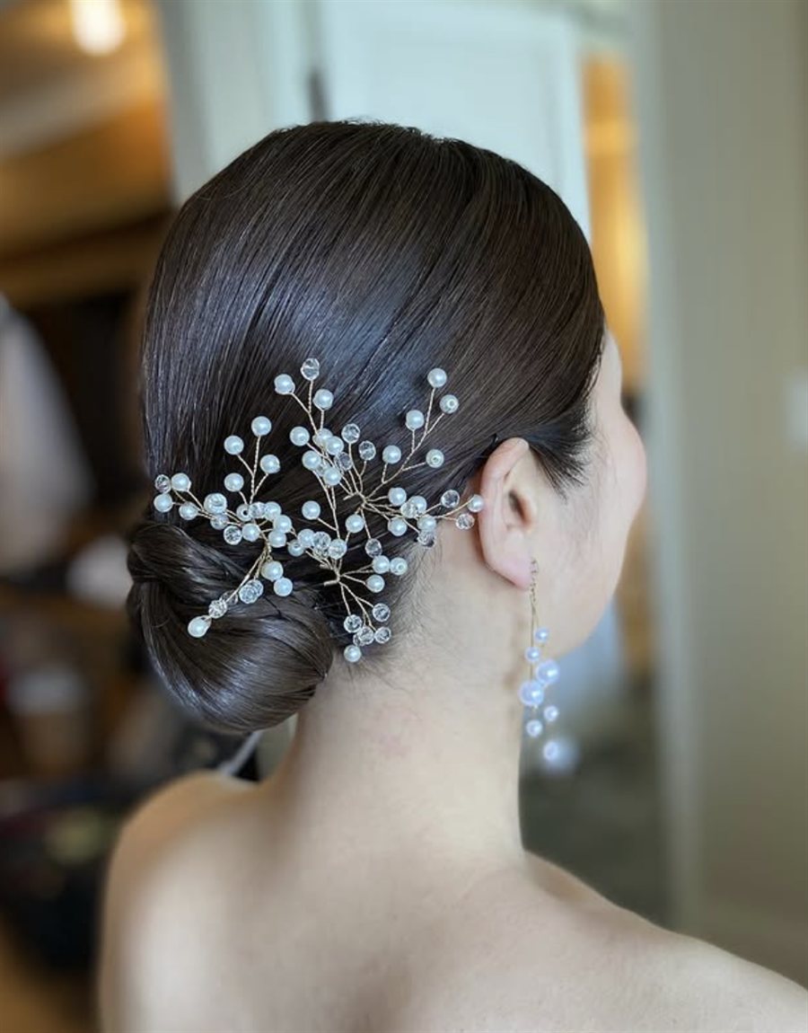 Low bun with pearl vine hairpiece