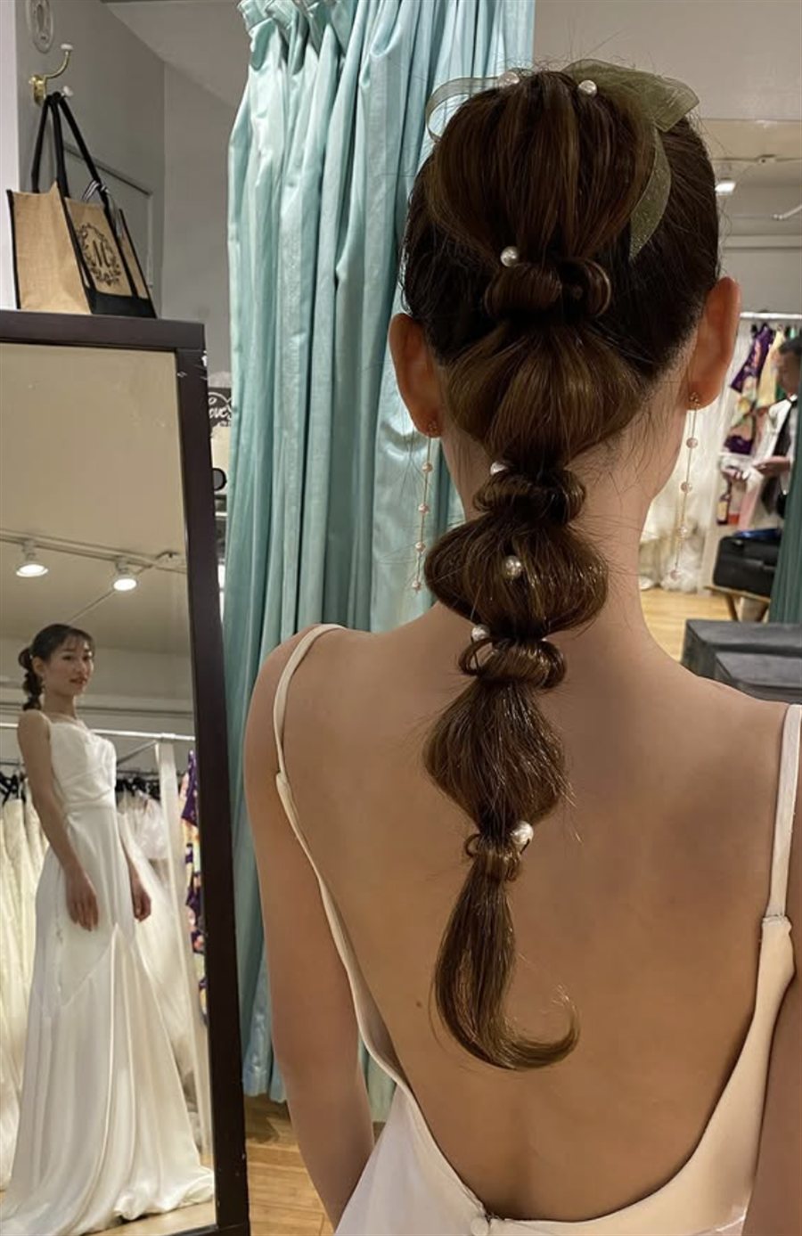 Bubble ponytail with pearls and ribbon bow