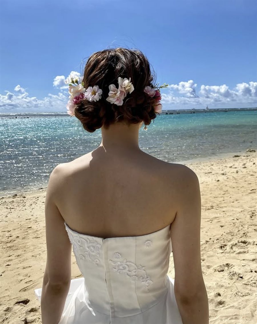 Beachside half-up style with flower crown